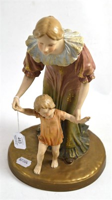 Lot 443 - Austrian figure group modelled as a lady with child, 33cm high