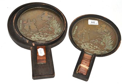 Lot 445 - A pair of Japanese bronze hand mirrors in wooden case