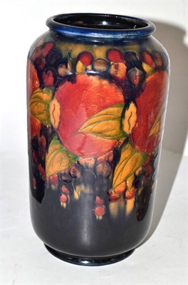 Lot 462 - A William Moorcroft Pomegranate pattern vase, on a blue ground, impressed BURSLEM factory marks and