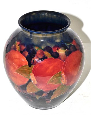 Lot 469 - A William Moorcroft Pomegranate pattern vase, on a blue ground, impressed BURSLEM factory marks and