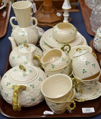 Lot 492 - Belleek table service comprising two teapots, cream jug, milk jug, sugar basin, preserve pot,...