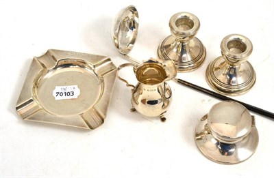 Lot 497 - Pair of silver dwarf candlesticks, silver cream jug, silver ashtray, inkwell and toddy ladle