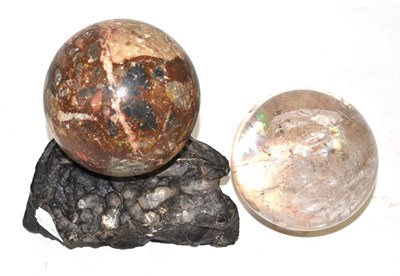 Lot 502 - Rock crystal ball on rock crystal stand and breccia marble ball on stand