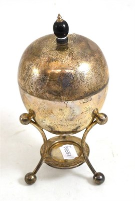 Lot 514 - An Edwardian silver egg coddler and cover, Sheffield 1910, of ovoid form, on three supports, wooden