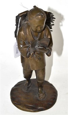 Lot 518 - A Japanese bronze figure, height 23cm