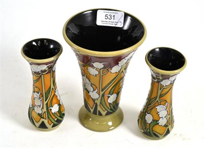 Lot 531 - Three modern Moorcroft A Token of Love (Sweet Lily of the Valley) pattern vases, designed by...