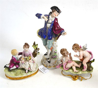 Lot 532 - A German porcelain figure of a gallant 23cm high and two Capodimonte style figure groups (3)