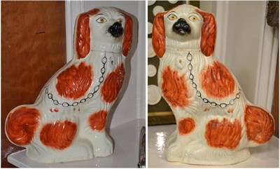 Lot 572 - Large pair of Staffordshire spaniel dogs with moulded bases, height 40cm