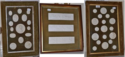 Lot 574 - Three panels of plaster medallions and plaques in velvet frames