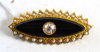 Lot 594 - A Victorian diamond set brooch, an old cut diamond within a concave lozenge shaped jet panel, to an