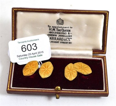 Lot 603 - A pair of cufflinks, the lozenge shaped heads bar linked and decorated with engine turned panels in