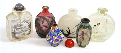 Lot 607 - Four glass, one enamel and one pottery snuff bottles (6)