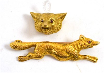 Lot 609 - A 9ct gold fox mask brooch, the snarling fox set with ruby eyes, measures 2.6cm by 2.1cm, and a...