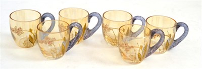 Lot 616 - A set of six Baccarat glass liqueur/cordial cups, with blue stained twisted cane handles,...