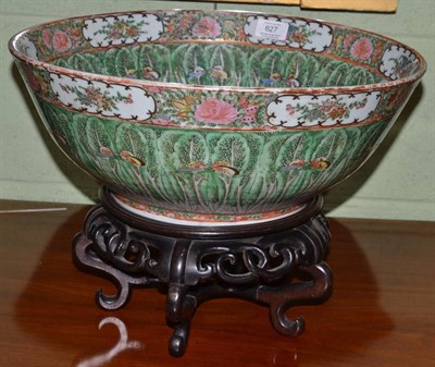 Lot 627 - A Cantonese porcelain punch bowl, late 19th century, decorated with butterflies on leaves, 39cm...