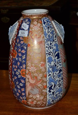 Lot 629 - A 19th century Japanese Imari vase with moth handles, height 35cm