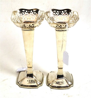 Lot 632 - A pair of Walker & Hall silver tapering vases, with loaded bases