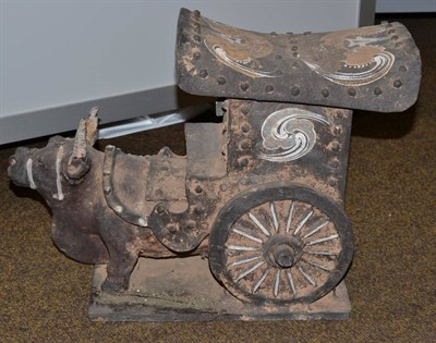 Lot 682 - A Chinese ceramic model of an oxen and carriage, decorated with floral design, stylistically...