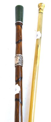 Lot 697 - A horn swagger stick with gilt metal pommel; and a bamboo walking stick with jade finial and silver