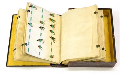 Lot 1068 - An Early Leather Covered Bookform Salmon Fly Reservoir, with tooled decoration, containing...