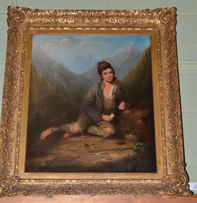 Lot 1254 - Continental School (19th century) A peasant boy at rest before a mountainous landscape, bears...