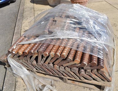 Lot 1325 - A pallet full of Victorian brown glazed garden edging tiles