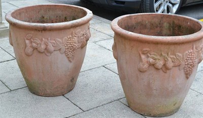 Lot 1326 - Pair of large terracotta planters decorated with vines and fruit, 65cm diameter