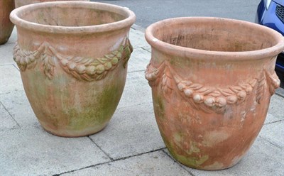 Lot 1337 - Pair of large terracotta planters decorated with swags, 69cm diameter