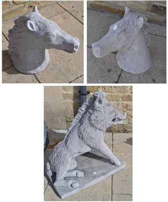 Lot 1353 - A pair of composition horse heads and a composition model of a boar