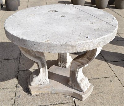 Lot 1357 - An Istrian marble table, early 20th century, the circular top on three scroll supports with paw...