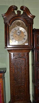 Lot 1387 - An oak eight day longcase clock, carved case with a swan neck pediment, 12-inch arched brass...