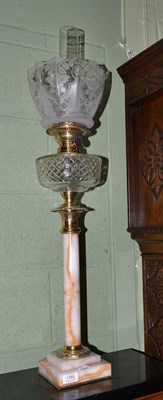 Lot 1389 - Victorian brass oil lamp with marble column support, 77cm high