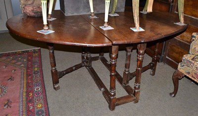 Lot 1405 - An 18th century oak gate leg table