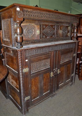 Lot 1415 - Carved oak court cupboard