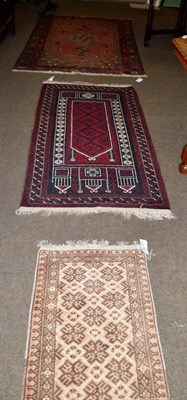 Lot 1419 - A Balouch prayer rug, West Afghanistan, the field with four latch hook medallions beneath the...