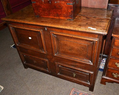 Lot 1437 - An early 18th century joined oak chest with hinged lid fielded panels and two drawers below