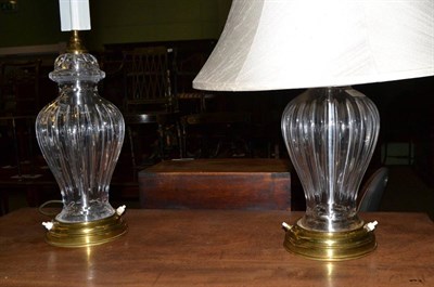 Lot 1440 - A pair of cut glass table lamps