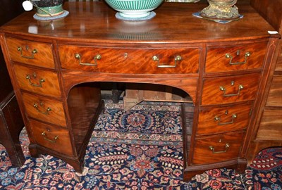 Lot 1441 - George III mahogany bow fronted desk