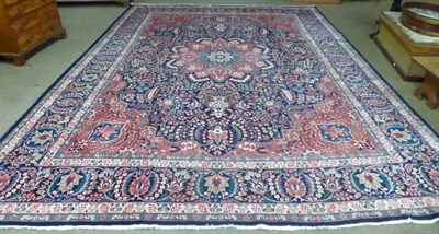 Lot 1442 - Tabriz carpet, Persian Azerbaijan, the deep indigo field with scrolling vines centred by a...