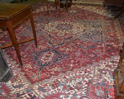 Lot 1443 - Heriz Carpet, Persian Azerbaijan, the burgundy field of angular vines around an indigo and...