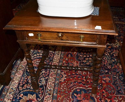 Lot 1445 - A 17th century walnut side table with spiral turned legs