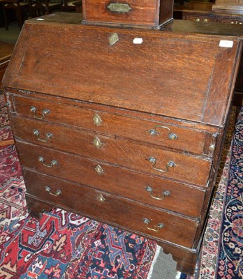 Lot 1446 - An 18th century oak bureau