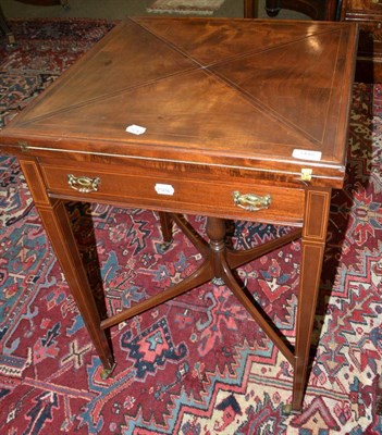 Lot 1448 - An Edwardian mahogany envelope card table