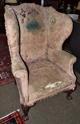 Lot 1449 - Late 19th century framed wing armchair with ball and claw feet