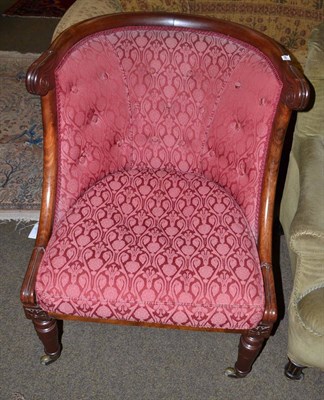 Lot 1466 - A William IV mahogany armchair on lotus carved legs with brass toes and casters