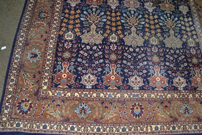 Lot 1469 - Veramin carpet, central Persia, the deep indigo field with a one-way design of urns issuing flowers