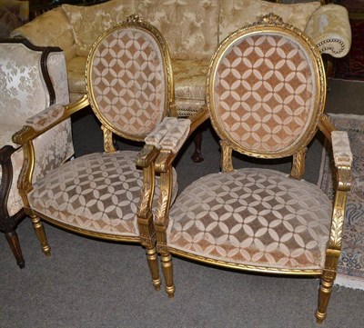 Lot 1471 - Pair of Louis XV style gilt open armchairs, recovered in velvet