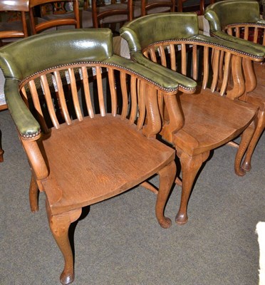 Lot 1474 - Pair of early 20th century oak and close nailed leather office armchairs