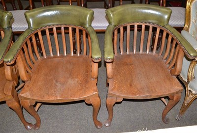 Lot 1475 - Pair of early 20th century oak and close nailed leather office armchairs