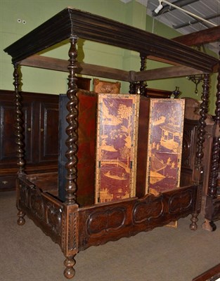 Lot 1514 - A Continental walnut four poster bed with spiral turned supports